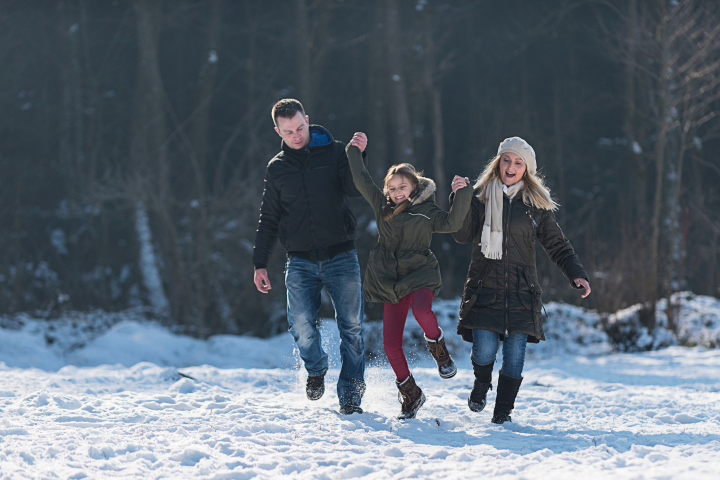 Family playing in snow